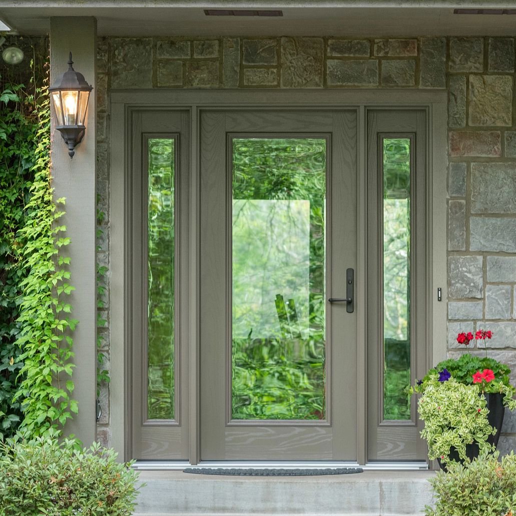 An sandtone Ensemble entry door with dual sidelights. Full glass lights and antique bronze hardware.