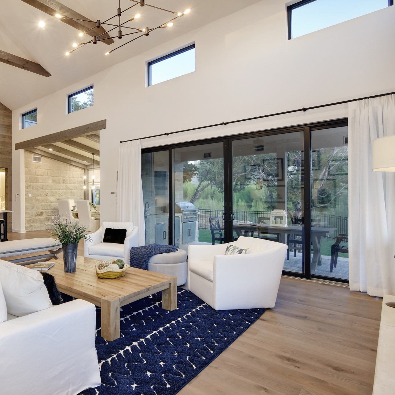 Black sliding patio doors, Narroline 200 series, in a lofted living room.