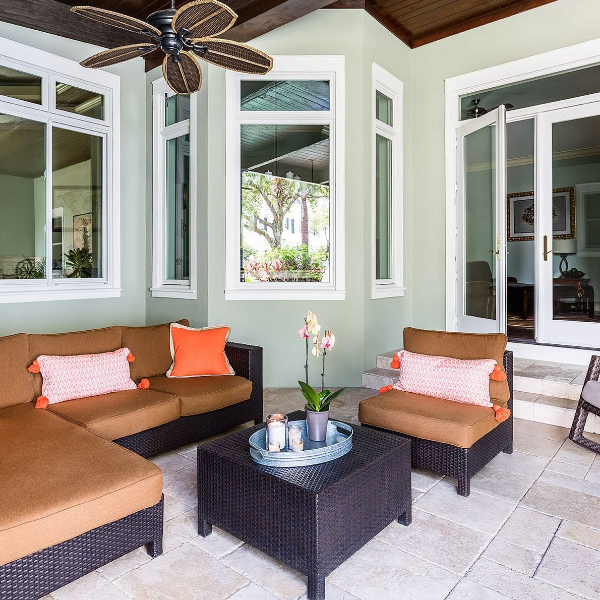 A Florida covered patio with french doors and picture and casement windows.